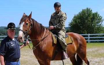 Major General Miguel Giordano, Uruguayan Defense Attaché to the US, saddles up on horse led by  Major James Marrinan, 2nd Company Governor&amp;#39;s Horse Guard in Newtown, Connecticut