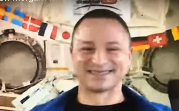 Army physician Col. Andrew Morgan administers oath of enlistment from International Space Station