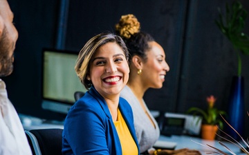 Employees collaborate in their workspace
