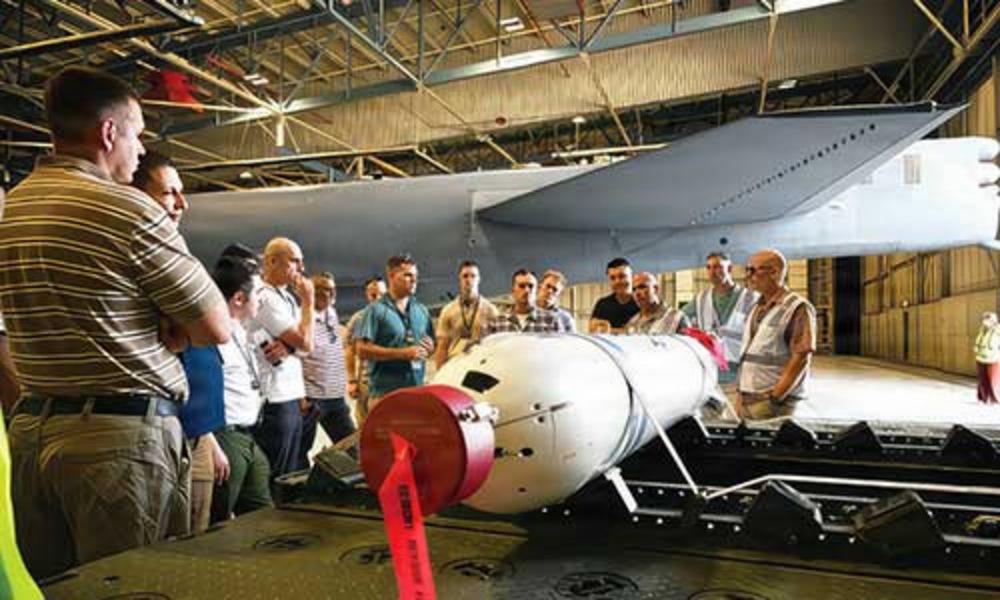 Russian interpreters examine missile components Thumbnail