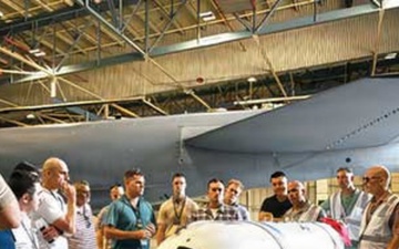 Russian interpreters examine missile components Thumbnail