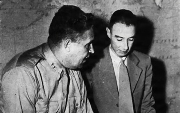 Gen. Leslie Groves, military head of the Manhattan Project, with physicists J. Robert Oppenheimer. Circa 1944.
