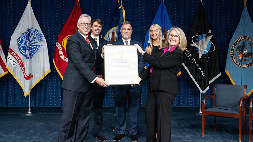 Mr.Hunter Lutinski, SES presenting at award presentation. Mr.Hunter Lutinski, SES presenting at award presentation.