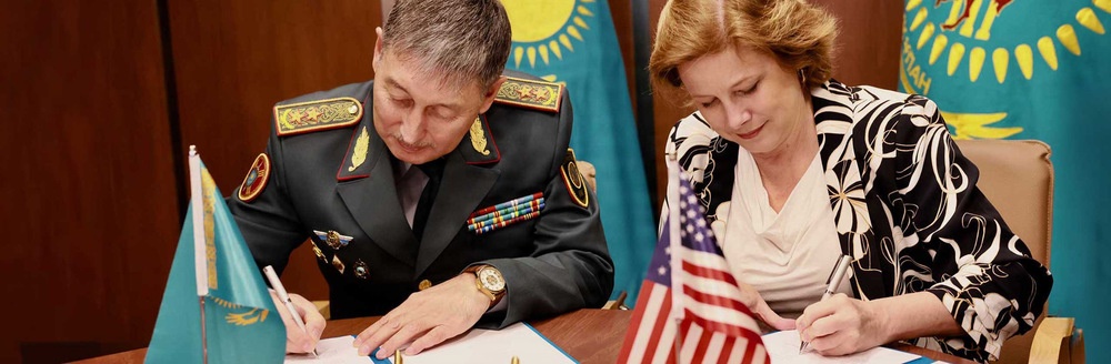 DTRA Director signing agreement with foreign leader