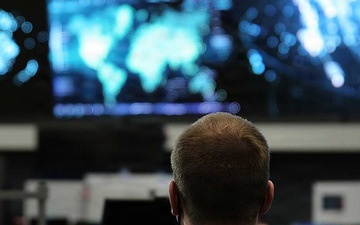 2 employees looking at screens in the NOSC