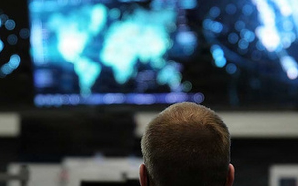 2 employees looking at screens in the NOSC