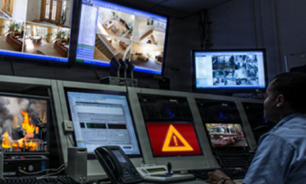 A Defense Threat Reduction Agency analyst monitors multiple computer screens as part of the Multi-Sensor Aerosol Rapid Monitoring System (MARMS) operations.