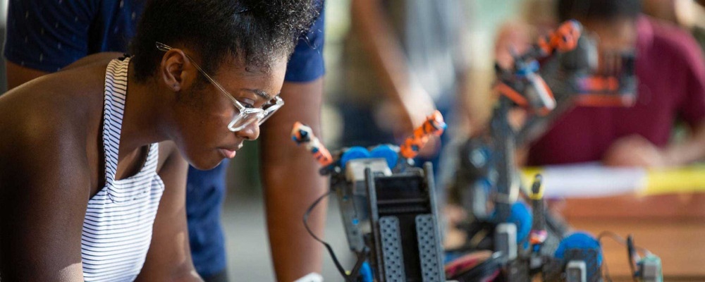 student working on a robot