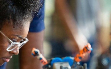 student working on a robot
