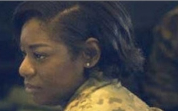 Military Personnel in front of Monitors