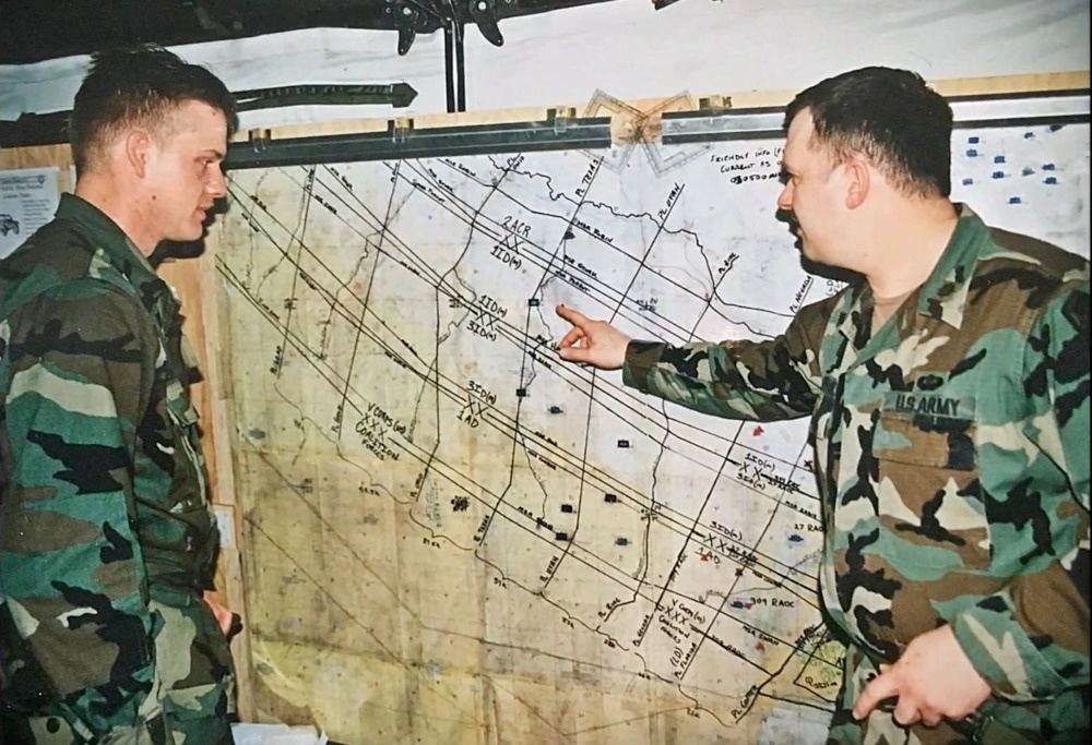 Two soldiers briefing tactical map