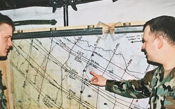 Two soldiers briefing tactical map