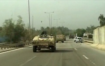 Soldiers Drive Through Baghdad