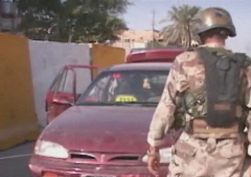 U.S. Army Soldiers Conduct a Traffic Control Point Inspection and Patrol