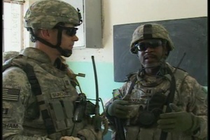 Soldiers Distribute School Supplies Package