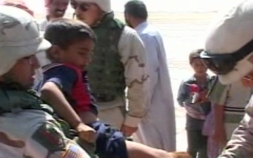 Soldiers Handing Out Clothing and Toys to Children