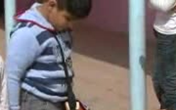 Paratroopers Distribute Donated Toys and Candy to a School