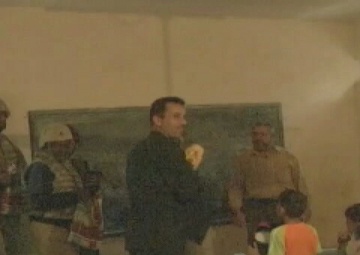 U.S. and Iraqi Soldiers Distribute School Supplies