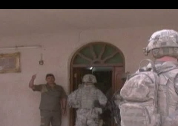 Soldiers Discuss Neighborhood Issues with Area Leader