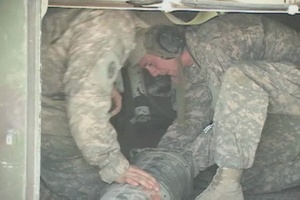 U.S. Soldiers Calibrate the M-109 Paladin Tank