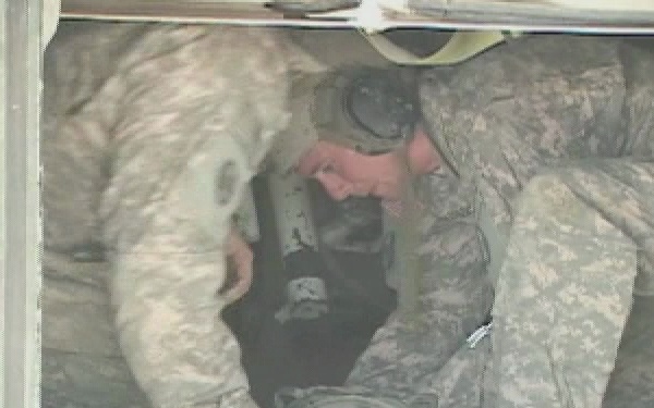 U.S. Soldiers Calibrate the M-109 Paladin Tank