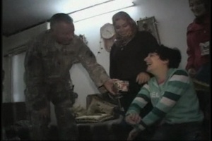 Civil Affairs Soldiers Donate Wheelchair to Unique Iraqi Artist