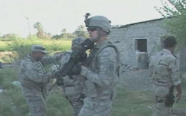 Operation Iraqi Freedom: Iraqi and U.S. Soldiers Conduct a Weapons Cache Se