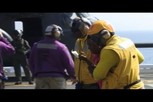 Haitian Victims Brought by Helicopter Aboard USS Bataan