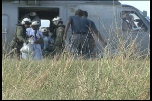 Haitian Patients Being Transported From the Medical Ship USNS Comfort