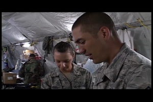 Aerospace Medical Technician Prepares ER Hand Sanitation Station