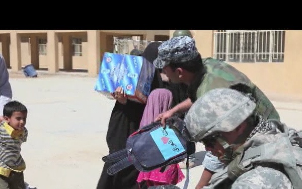 U.S. Soldiers and Iraqi Federal Police Officers Distribute Humanitarian Aid