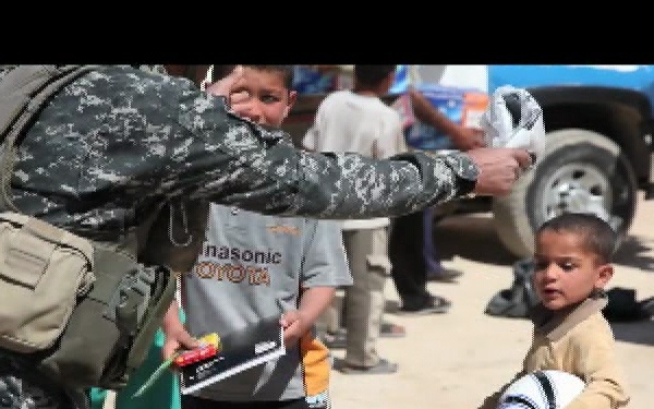 U.S. Soldiers and Iraqi Federal Police Officers Distribute Humanitarian Aid