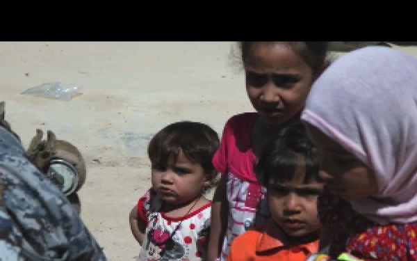 U.S. Soldiers and Iraqi Federal Police Officers Distribute Humanitarian Aid
