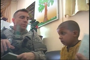 Air Force Medic Examines an Iraqi Boy With Heart Problems