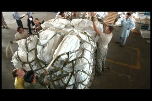 U.S. Airmen Load C-130s