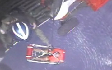 Coast Guard Rescues Two Men From Capsized Boat