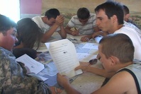 US KFOR Soldiers teach English to local children.