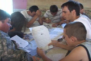 US KFOR Soldiers teach English to local children.