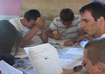 US KFOR Soldiers teach English to local children.