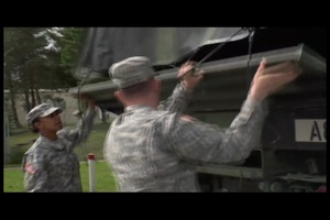 Multi-National Team Helps Unload Sandbags