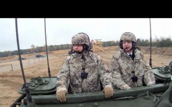 Latvian Prime Minister and Chairman of Defense Ride with Soldiers