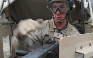 Engineers with 1st Combat Engineer Battalion, 1st Marine Division (Forward), function check their weapons