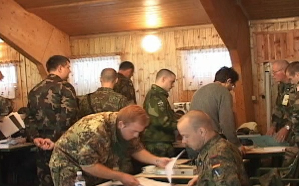 Soldiers attend paymaster meeting in Kosovo
