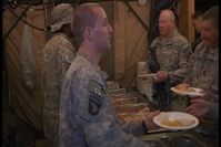 Contractors and Soldiers Prepare Christmas Dinner at FOB Wilson
