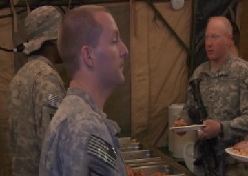 Contractors and Soldiers Prepare Christmas Dinner at FOB Wilson