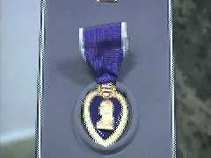 LTG Cone Presents SFC McKee with Purple Heart Award