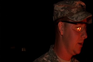 Airman and Soldiers Gather Around a Campfire