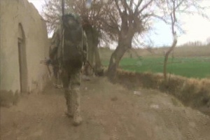 Irish Guards haul gear during resupply patrol