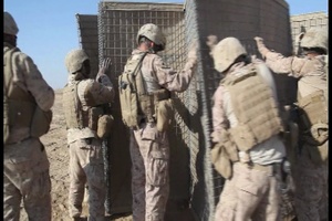 Garmser - Marines with 1st Combat Engineer Battalion set up Hesco Barriers for a New Patrol Base