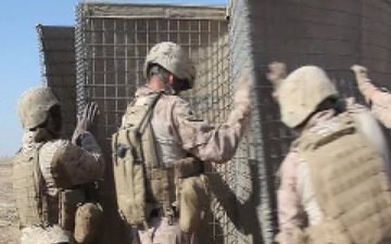 Garmser - Marines with 1st Combat Engineer Battalion set up Hesco Barriers for a New Patrol Base